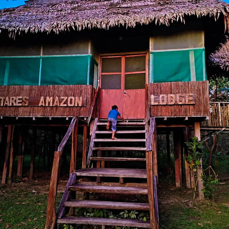 Entrance of the lodge dining area with a welcoming atmosphere, surrounded by natural scenery, ideal for guests and tourists