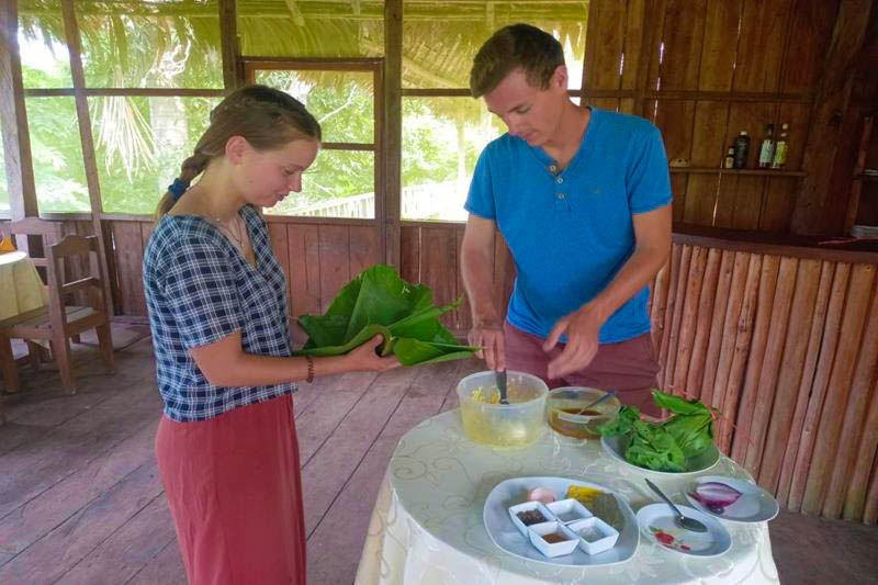 Preparing juane, a traditional dish from the Peruvian rainforest, in a cooking workshop