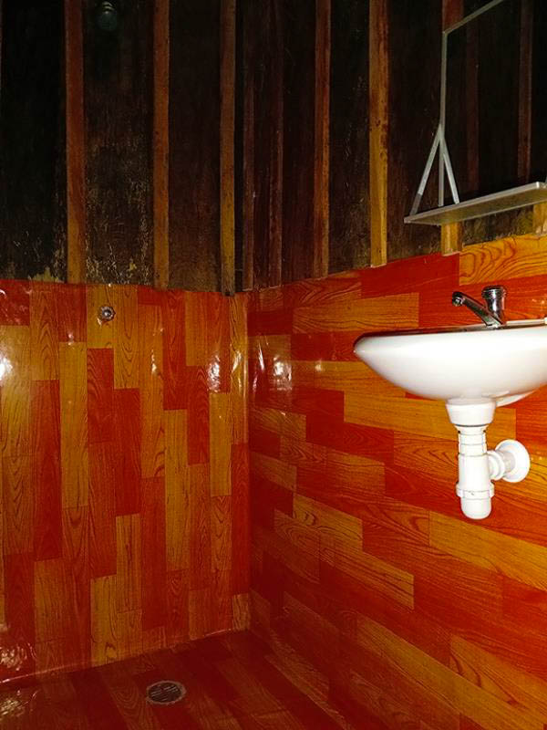 Shower inside a bungalow at Antares Amazon Lodge with rustic wooden design